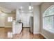 Open kitchen features bright white cabinets and hardwood floors at 1420 Red Crest Ln # 202, Las Vegas, NV 89144