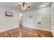 Bright living room features hardwood floors and a ceiling fan at 1420 Red Crest Ln # 202, Las Vegas, NV 89144