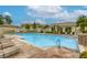 Community pool area featuring lounge chairs and a sparkling swimming pool at 1420 Red Crest Ln # 202, Las Vegas, NV 89144