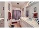 Well-lit bathroom featuring a vanity with a marble countertop and a shower with a curtain at 1420 Vegas Valley Dr # 22, Las Vegas, NV 89169