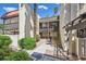 Two-story exterior showcasing well-maintained walkways, private entrances, and vibrant landscaping on a sunny day at 1420 Vegas Valley Dr # 22, Las Vegas, NV 89169