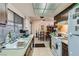 A functional kitchen showcases laminate countertops, wood cabinets, and modern appliances at 1420 Vegas Valley Dr # 22, Las Vegas, NV 89169