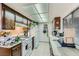 Efficient kitchen layout with essential appliances, wood cabinets and tiled floors at 1420 Vegas Valley Dr # 22, Las Vegas, NV 89169