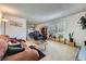 A cozy living room featuring neutral carpet, a comfortable sofa, and sliding glass doors to an outdoor space at 1420 Vegas Valley Dr # 22, Las Vegas, NV 89169