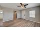 A view into bedroom featuring wood-look flooring, closet door and neutral color scheme at 155 Magnesium St, Henderson, NV 89015