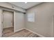 Bedroom showcasing a neutral color palette and wood look flooring with a view of a doorway at 155 Magnesium St, Henderson, NV 89015