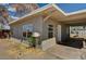 Side view of home with stucco exterior, covered parking area and simple landscaping at 155 Magnesium St, Henderson, NV 89015