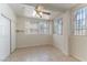 Bedroom with tile flooring, a ceiling fan, and windows providing natural light at 1570 Jamielinn Ln # 104, Las Vegas, NV 89110