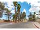 Gated entrance to Emerald Gardens, with mature trees and landscaping at 1570 Jamielinn Ln # 104, Las Vegas, NV 89110