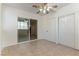 Bright dining area with tile floors, ceiling fan and sliding glass doors to the exterior of the home at 1570 Jamielinn Ln # 104, Las Vegas, NV 89110