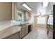 Well-lit kitchen featuring modern appliances and light wood cabinetry at 1570 Jamielinn Ln # 104, Las Vegas, NV 89110