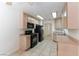 Well-equipped kitchen featuring black appliances and ample cabinet space at 1570 Jamielinn Ln # 104, Las Vegas, NV 89110