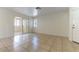 Bright living room with tile flooring and a sliding glass door at 1570 Jamielinn Ln # 104, Las Vegas, NV 89110