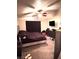 Bedroom with carpet, TV, dresser and large window, offering a comfortable living space at 1612 Lefty Garcia Way, Henderson, NV 89002
