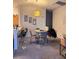 Open dining area next to kitchen with seating for six and decorative pendant lighting at 1612 Lefty Garcia Way, Henderson, NV 89002