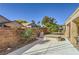 Cozy backyard featuring a patio with a hot tub and landscaped garden area at 2105 Poppywood Ave, Henderson, NV 89012
