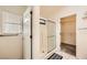 Well-lit ensuite bath featuring a large shower and linen closet at 2105 Poppywood Ave, Henderson, NV 89012