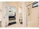 Bathroom featuring a glass-enclosed shower, toilet, and doorway view to a bedroom with plantation shutters at 2105 Poppywood Ave, Henderson, NV 89012