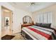 Well-lit bedroom with a large window with window shutters at 2105 Poppywood Ave, Henderson, NV 89012