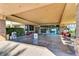 Covered entrance with a wide walkway, benches and planting areas to welcome residents at 2105 Poppywood Ave, Henderson, NV 89012