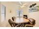 Dining room featuring tile floors, plantation shutters, and a ceiling fan at 2105 Poppywood Ave, Henderson, NV 89012