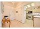 Inviting foyer with tiled floors, light walls, and a view into the kitchen at 2105 Poppywood Ave, Henderson, NV 89012
