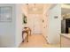 Bright entryway with tiled flooring, a pendant light, and a view of the kitchen at 2105 Poppywood Ave, Henderson, NV 89012