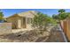 Well-maintained single-story home with desert landscaping and backyard patio area at 2105 Poppywood Ave, Henderson, NV 89012