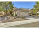 Attractive single-story home with a two-car garage and low-maintenance landscaping at 2105 Poppywood Ave, Henderson, NV 89012