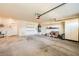 Organized two-car garage with storage cabinets, shelving, and functional utility sink area at 2105 Poppywood Ave, Henderson, NV 89012