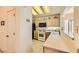 Well-lit kitchen with stainless appliances and breakfast bar at 2105 Poppywood Ave, Henderson, NV 89012