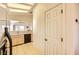 Functional kitchen area with views into the living space featuring a kitchen door to the hallway at 2105 Poppywood Ave, Henderson, NV 89012