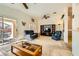 Cozy living room with sliding glass doors to the outdoor patio and entertainment center at 2105 Poppywood Ave, Henderson, NV 89012