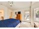 Comfortable bedroom with a door to the backyard, and ensuite bathroom at 2105 Poppywood Ave, Henderson, NV 89012