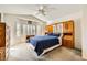 Comfortable main bedroom with a bay window, shutters, carpet, and built in storage at 2105 Poppywood Ave, Henderson, NV 89012