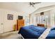 Spacious main bedroom featuring natural light, a TV, and an ensuite bath, ideal for relaxation at 2105 Poppywood Ave, Henderson, NV 89012
