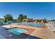 Community pool and spa area with plenty of lounge chairs and shaded seating under pergolas at 2105 Poppywood Ave, Henderson, NV 89012