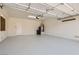 Clean, spacious garage with epoxy flooring, water heater, and ample storage space at 2372 Perrysburg Dr, Henderson, NV 89044