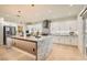 Bright, open kitchen featuring modern appliances, a large island, and white cabinetry at 2372 Perrysburg Dr, Henderson, NV 89044