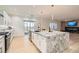 Modern kitchen with granite countertops, stainless steel appliances, and access to an outdoor patio at 2372 Perrysburg Dr, Henderson, NV 89044