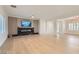 Spacious living room with hardwood floors, modern fireplace and feature wall at 2372 Perrysburg Dr, Henderson, NV 89044