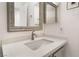 Stylish bathroom vanity featuring a modern sink, quartz countertop, and decorative framed mirror at 2520 Springridge Dr, Las Vegas, NV 89134