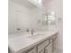 Well-lit bathroom features a large mirror, stylish vanity with seating area, and modern fixtures at 2520 Springridge Dr, Las Vegas, NV 89134