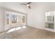 Bright bedroom featuring a cozy sitting area near a bay window and ensuite bathroom access at 2520 Springridge Dr, Las Vegas, NV 89134