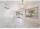 Spacious dining area featuring marble floors, a ceiling fan, and a view of the backyard at 2520 Springridge Dr, Las Vegas, NV 89134