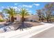 Attractive single-story home with drought-tolerant landscaping, palm trees, and a spacious two-car garage at 2520 Springridge Dr, Las Vegas, NV 89134
