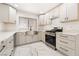 Renovated kitchen showcasing new cabinets, stainless steel appliances, farmhouse sink, and marble countertops at 2520 Springridge Dr, Las Vegas, NV 89134