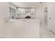 Modern kitchen with white cabinets, marble countertops, and stainless steel appliances at 2520 Springridge Dr, Las Vegas, NV 89134