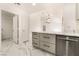 View of the kitchen features gray cabinets, marble countertops, and stainless steel appliances at 2520 Springridge Dr, Las Vegas, NV 89134