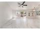 Bright open-concept living room featuring marble floors and a ceiling fan at 2520 Springridge Dr, Las Vegas, NV 89134